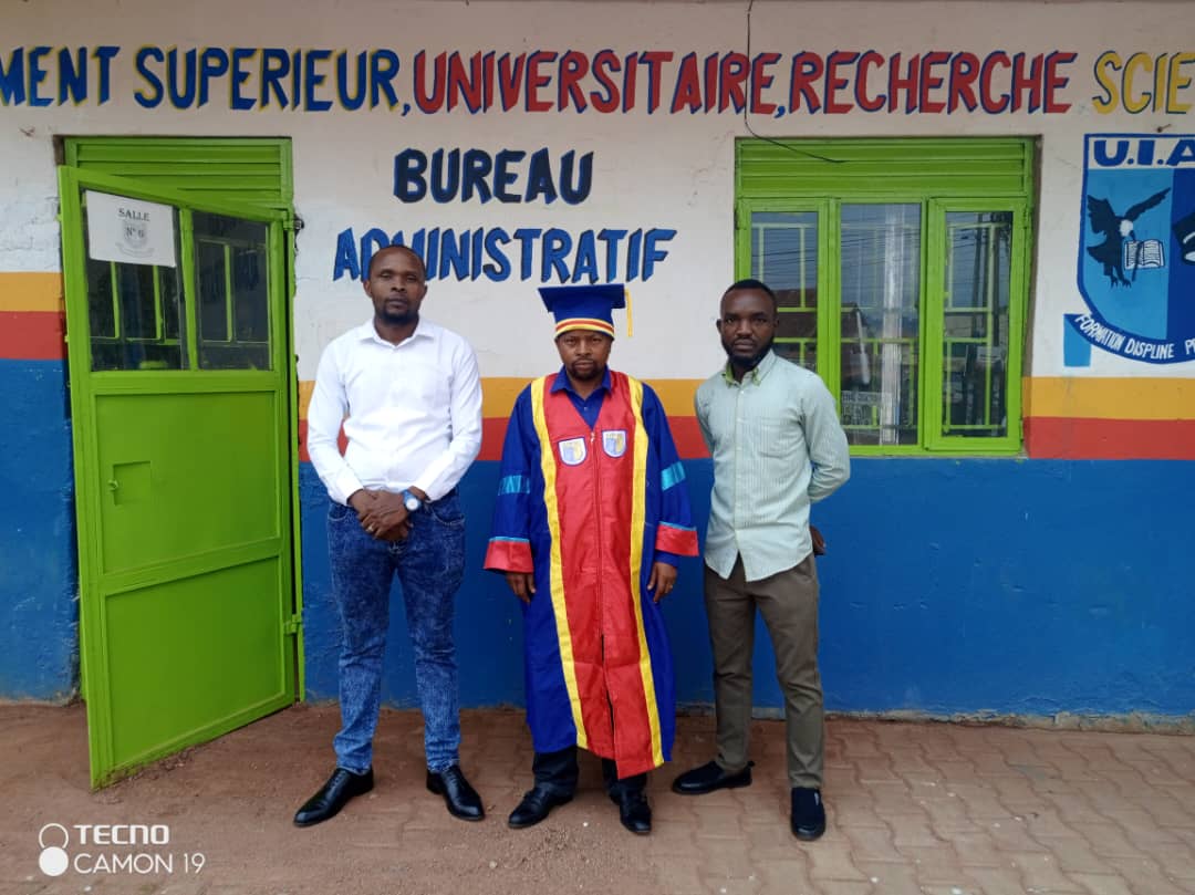 UIAC academic leaders in front of the administrative office